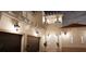 A two-story house with a two-car garage, tile roof, and outdoor lighting at 3523 Trebor Ln, Sarasota, FL 34235