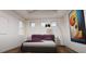 Serene bedroom with hardwood floors and large art at 3523 Trebor Ln, Sarasota, FL 34235