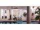 Relaxing pool area with outdoor dining and a shaded patio at 3523 Trebor Ln, Sarasota, FL 34235
