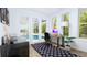 Bright home office with pool view and stylish rug at 3523 Trebor Ln, Sarasota, FL 34235