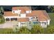 An aerial view of a luxury home with pool and three-car garage at 3523 Trebor Ln, Sarasota, FL 34235