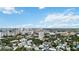 Wide aerial view of the neighborhood and coastline at 1650 Pine Tree Ln # 103, Sarasota, FL 34236