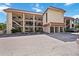 Two-story condominium building with parking and landscaping at 1650 Pine Tree Ln # 103, Sarasota, FL 34236