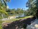 Property waterfront view of a canal with a private dock at 1650 Pine Tree Ln # 103, Sarasota, FL 34236