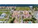 Aerial view showing community with water access, pool, green rooftop, and landscaping at 1450 Silvia Shores Dr, Apollo Beach, FL 33572