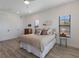 Bedroom with natural light, and minimalist furniture at 1450 Silvia Shores Dr, Apollo Beach, FL 33572