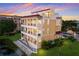 Beautiful multi-story building with balconies, well-maintained landscaping, and pond at 1450 Silvia Shores Dr, Apollo Beach, FL 33572