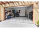 Spacious two car garage provides ample storage with bikes, water toys, shelving, and extra tools at 1450 Silvia Shores Dr, Apollo Beach, FL 33572