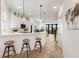 Modern kitchen with white cabinets, breakfast bar seating, and stainless steel appliances at 1450 Silvia Shores Dr, Apollo Beach, FL 33572