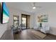 Bright sitting area features vinyl floors, comfortable seating, and a glass door to the terrace at 1450 Silvia Shores Dr, Apollo Beach, FL 33572