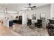 Open living space with modern decor and kitchen area with stainless steel appliances at 1450 Silvia Shores Dr, Apollo Beach, FL 33572