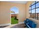 Inviting rooftop terrace with seating, synthetic grass, and arched doorway at 1450 Silvia Shores Dr, Apollo Beach, FL 33572