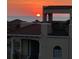 Rooftop view of a stunning sunset over the water, with townhome architectural features at 1450 Silvia Shores Dr, Apollo Beach, FL 33572