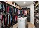 Spacious walk-in closet with custom shelving and ample storage space at 1450 Silvia Shores Dr, Apollo Beach, FL 33572