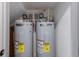 A pair of AO Smith water heaters are housed in a closet with utility access at 1450 Silvia Shores Dr, Apollo Beach, FL 33572