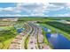 Stunning aerial view showcasing the community's layout, golf courses, and surrounding lakes at 17704 Gawthrop Dr # 402, Bradenton, FL 34211