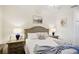 Cozy bedroom with neutral decor, ceiling fan, and comfortable furnishings at 17704 Gawthrop Dr # 402, Bradenton, FL 34211