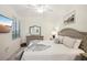 Comfortable bedroom with a king-size bed and large TV at 17704 Gawthrop Dr # 402, Bradenton, FL 34211