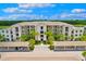 Beautiful condominium complex featuring lush palm trees and covered parking at 17704 Gawthrop Dr # 402, Bradenton, FL 34211