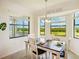 Cozy dining area with views of the golf course, offering a picturesque and tranquil dining experience at 17704 Gawthrop Dr # 402, Bradenton, FL 34211