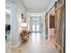 Light and airy entry hall showcasing tile flooring and barn doors at 9123 Isabella Cir, Parrish, FL 34219