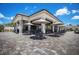 Outdoor community clubhouse with seating and umbrellas at 17704 Gawthrop Dr # 402, Bradenton, FL 34211