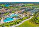 Aerial view of community with resort-style pool and clubhouse at 17704 Gawthrop Dr # 402, Bradenton, FL 34211