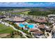 Aerial view of community with clubhouse, pool, and golf course at 17704 Gawthrop Dr # 402, Bradenton, FL 34211