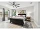 Spacious bedroom with a ceiling fan and large windows at 5802 Alabaster Stone Ln, Apollo Beach, FL 33572