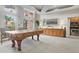 Game room with pool table, kitchenette, and access to outdoor spaces at 808 3Rd W Ave # 514, Bradenton, FL 34205