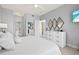 King bedroom with ensuite bathroom access and bright decor at 808 3Rd W Ave # 514, Bradenton, FL 34205