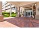Condo building entrance with brick paved pathway at 808 3Rd W Ave # 514, Bradenton, FL 34205
