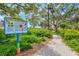 Butterfly garden with informational signage along a walking path at 808 3Rd W Ave # 514, Bradenton, FL 34205