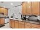 Well-equipped kitchen featuring granite countertops and wood cabinets at 808 3Rd W Ave # 514, Bradenton, FL 34205