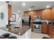 Modern kitchen with stainless steel appliances and granite countertops at 808 3Rd W Ave # 514, Bradenton, FL 34205