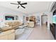 Spacious living room with light beige couches, coffee table, and tile floors at 808 3Rd W Ave # 514, Bradenton, FL 34205
