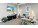 Relaxing TV area with comfortable seating and coastal-themed artwork at 808 3Rd W Ave # 514, Bradenton, FL 34205