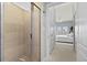 Shower with glass enclosure and view to bedroom at 808 3Rd W Ave # 514, Bradenton, FL 34205
