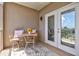 Private balcony with seating and access to outdoor space at 808 3Rd W Ave # 514, Bradenton, FL 34205