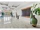 Modern condo lobby with water feature and seating at 808 3Rd W Ave # 514, Bradenton, FL 34205