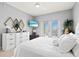Main bedroom with a king bed, mounted TV, and large windows at 808 3Rd W Ave # 514, Bradenton, FL 34205