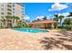 Resort-style pool with plenty of lounge chairs and a covered area at 808 3Rd W Ave # 514, Bradenton, FL 34205