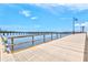 Wooden pier extending over the water with views of a bridge at 808 3Rd W Ave # 514, Bradenton, FL 34205