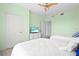 Bright guest bedroom with two twin beds and a dresser at 808 3Rd W Ave # 514, Bradenton, FL 34205