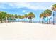 Beach volleyball court with palm trees and water views at 808 3Rd W Ave # 514, Bradenton, FL 34205