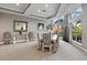 Elegant dining area with a large table and zebra-print chairs at 808 3Rd W Ave # 514, Bradenton, FL 34205