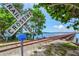 Railroad crossing with a view of a bridge and calm water at 808 3Rd W Ave # 514, Bradenton, FL 34205