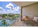 Balcony with table and chairs, offering water views at 808 3Rd W Ave # 514, Bradenton, FL 34205