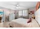 Spacious bedroom with a dresser, a queen bed and plenty of natural light at 6038 Coral Way, Bradenton, FL 34207