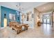 Dining area with a rustic wooden table and access to other areas at 9123 Isabella Cir, Parrish, FL 34219